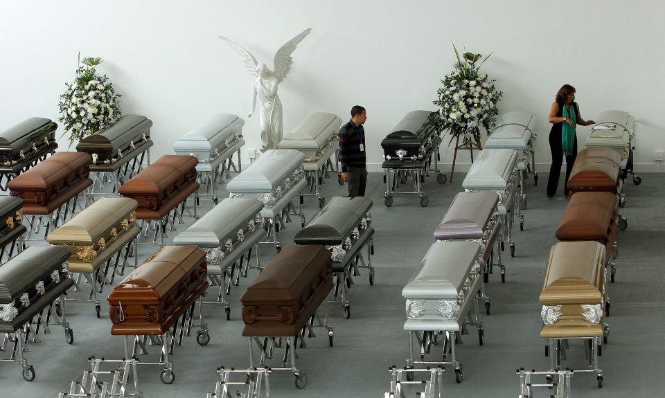 Funeral workers have been busy preparing the coffins for a wake