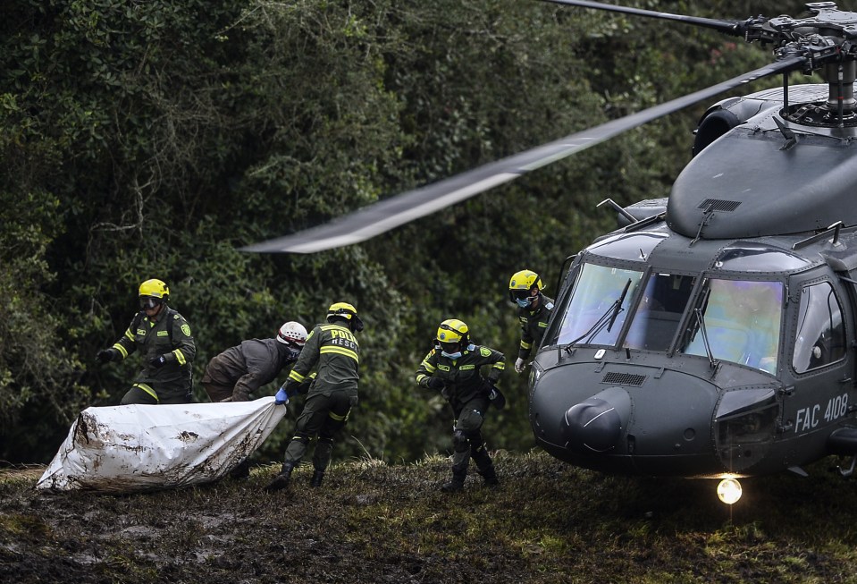 Police and rescue teams recover the bodies of victims of the LAMIA airlines charter that crashed in the mountains 