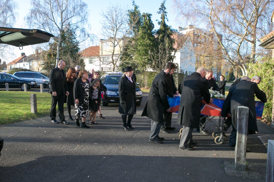  Mourners wearing red and blue were given Eagles badges and forget-me-not seeds to sow to remember tragic victim