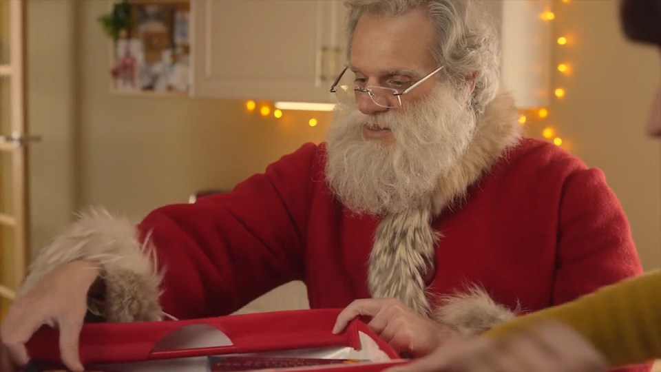 Santa unboxes all the items that Iceland have sent for the couple to enjoy