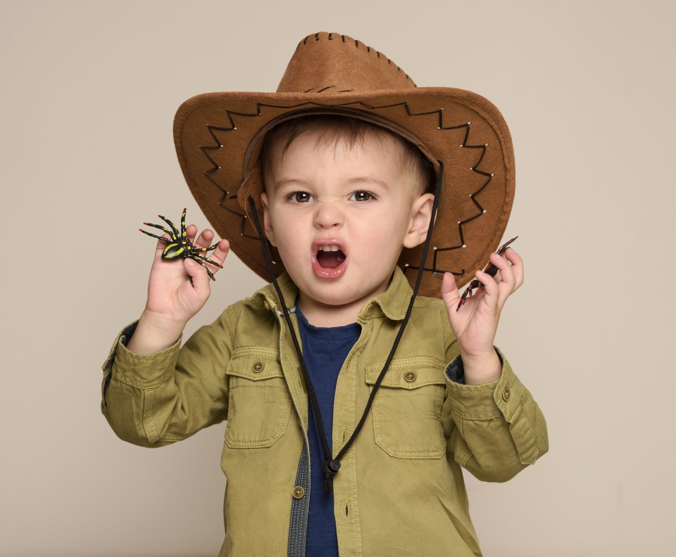  He happily posed with spiders - something his dad could never do