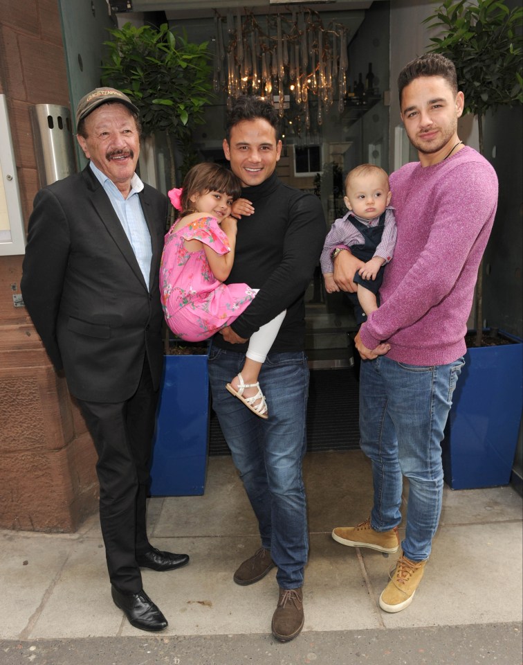 Dougie James with sons Ryan (centre) and Adam (right) - and two of his grandkids