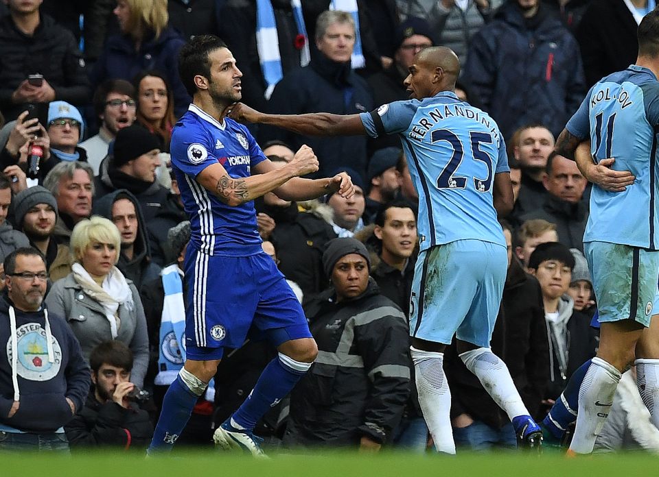 Fernandinho fights with Chelsea's Spanish midfielder Cesc Fabregas 