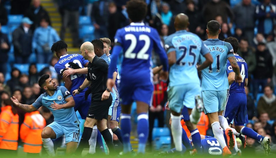 Referee Anthony Taylor tries to calm down both sets of players 