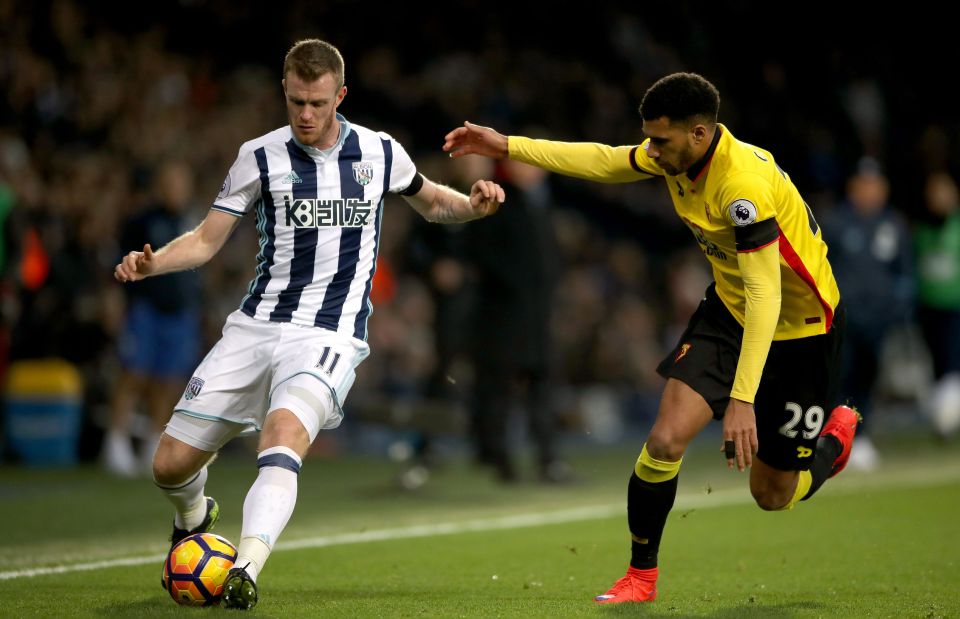 West Bromwich Albion's Chris Brunt and Watford's Etienne Capoue battle for the ball 