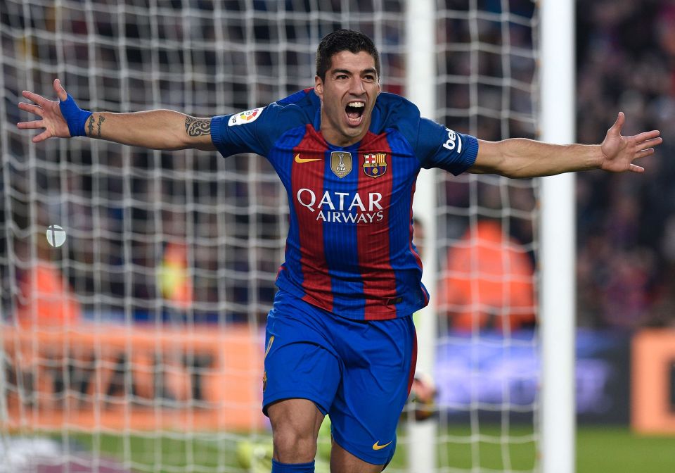  Luis Suarez wheels away after putting Barcelona into a 1-0 lead early in the first half