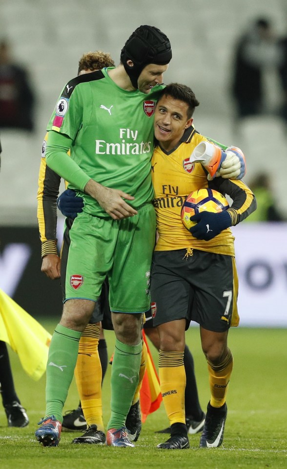 Petr Cech congratulates Sanchez as he walks off with the ball