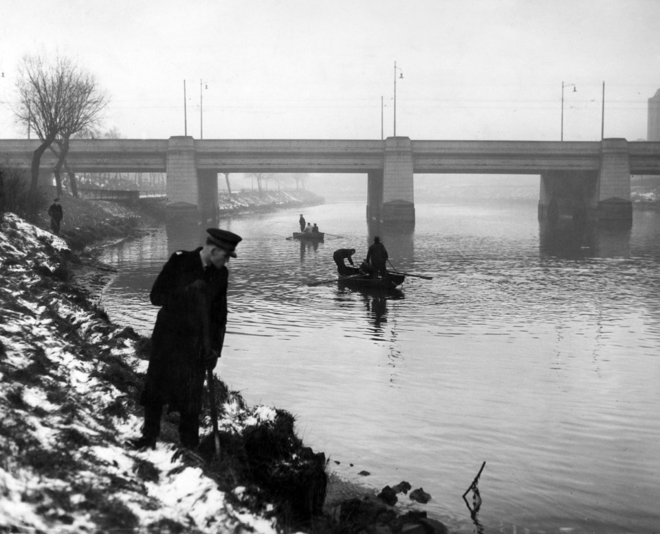 Police search the river at Uddingston following a triple murder of the Smart family, 