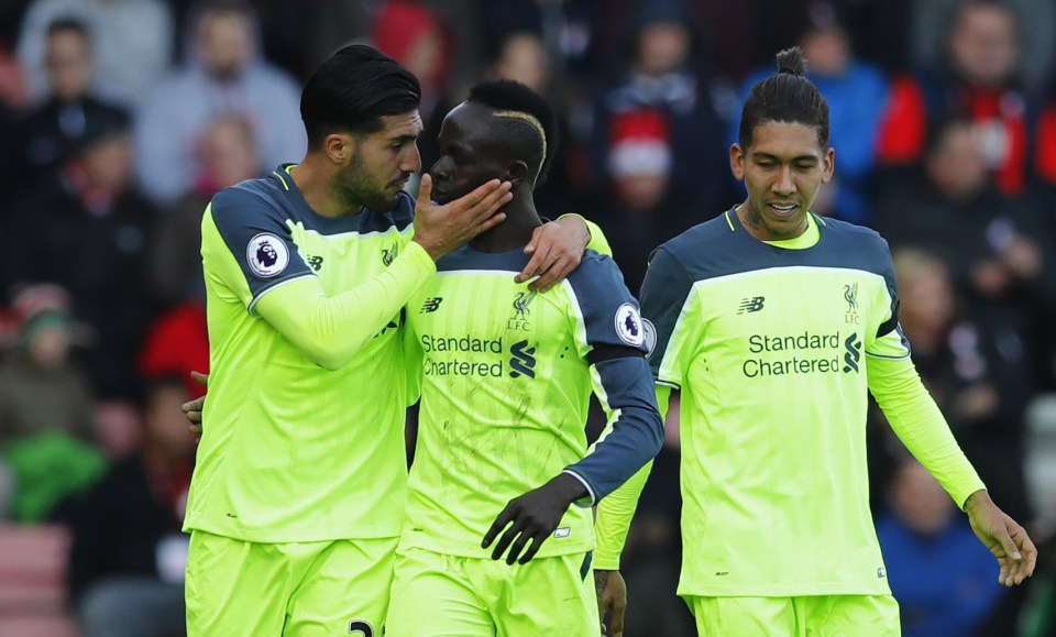 Liverpool's Sadio Mane is congratulated by his team-mates after scoring the game's opening goal