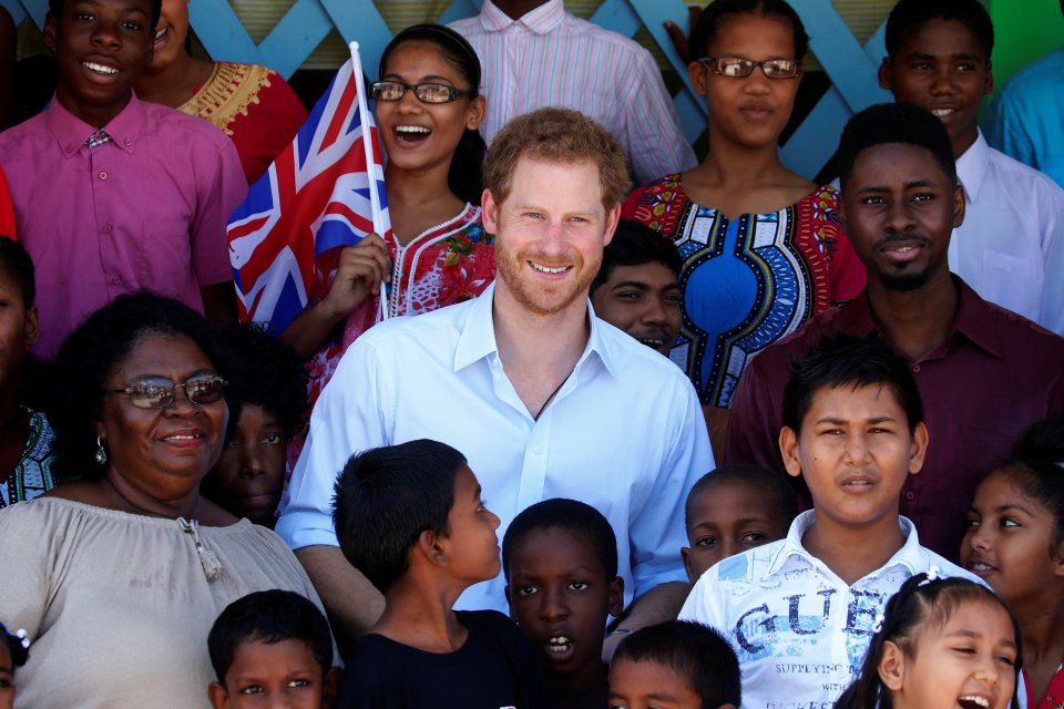  Prince Harry visited a children's home founded by a religious sect known as the Moonies on the final day of his Caribbean tour