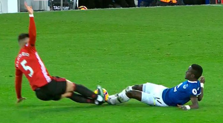 Marcos Rojo dived in terribly late on Idrissa Gueye with both feet off the ground