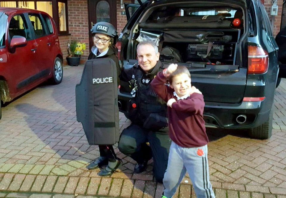 Megan and Andrew with Damo Stevens, one of the stars of television programme Police Interceptors