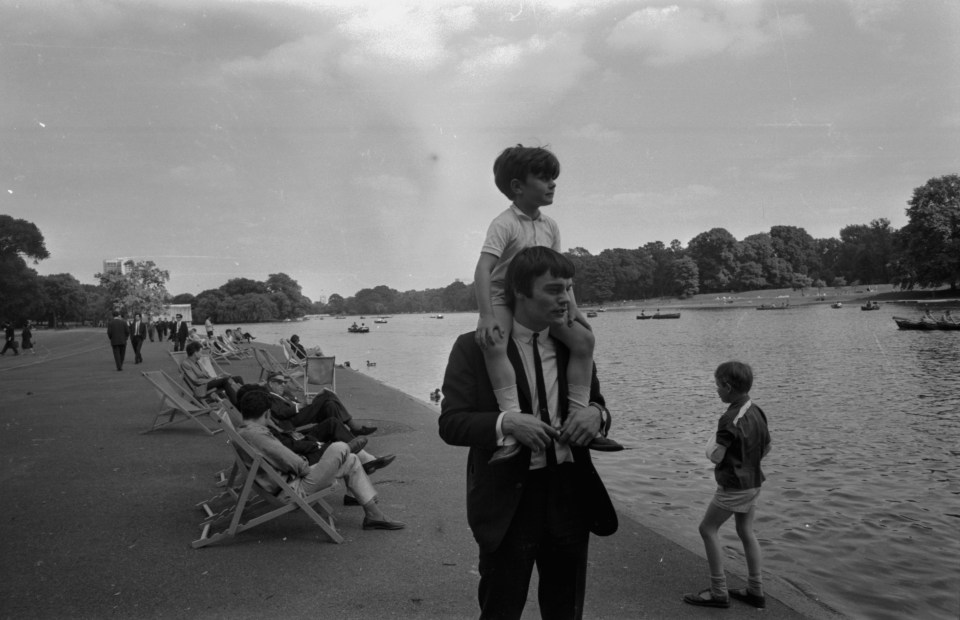  Jimmie Nicol, one time back-up drummer for The Beatles, strolling around Hyde Park with his son Howard on his shoulders