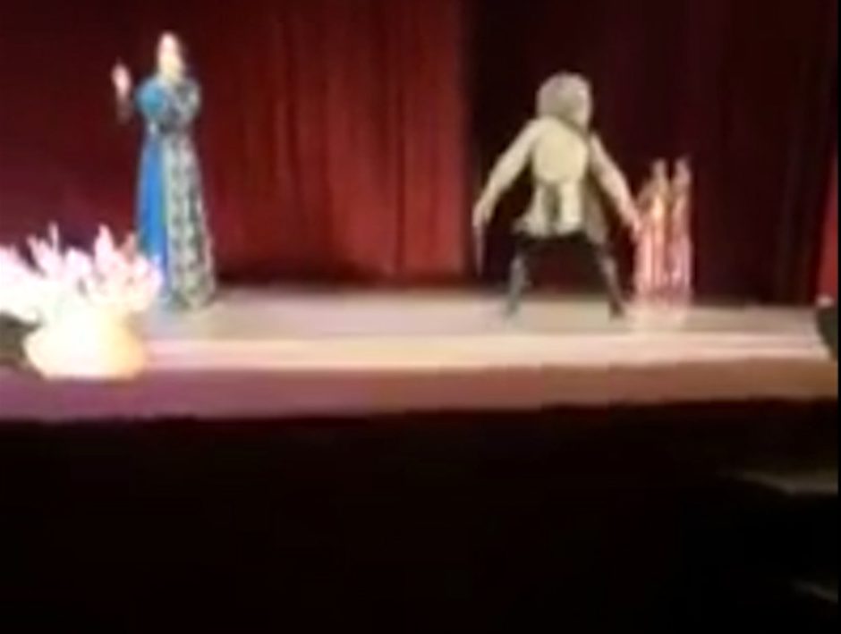  Khusainov was dancing energetically on the stage while a singer performed a Chechen song