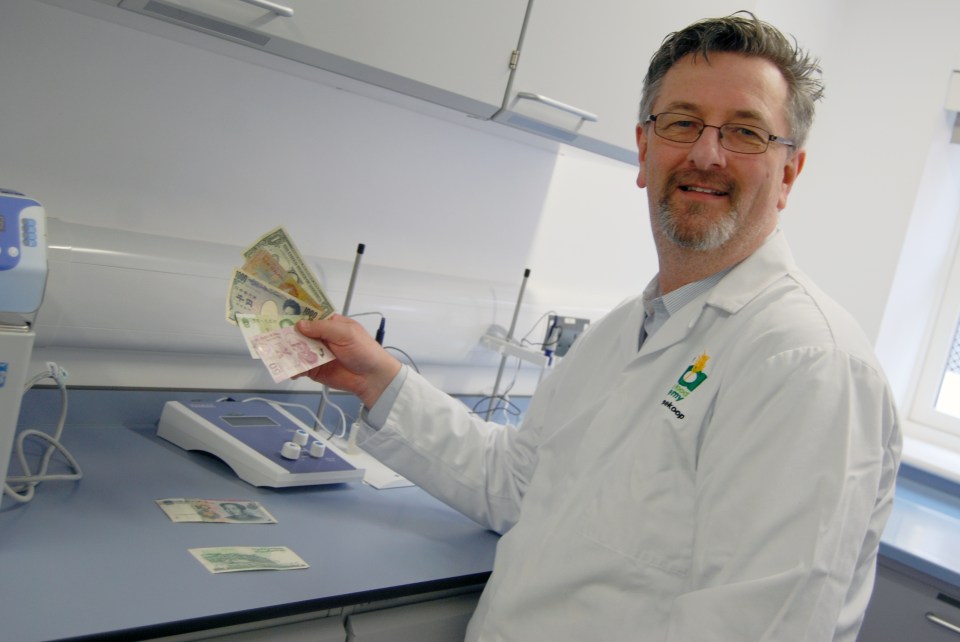  Professor Frank Vriesekoop holds notes found that less bacteria sticks to polymer notes