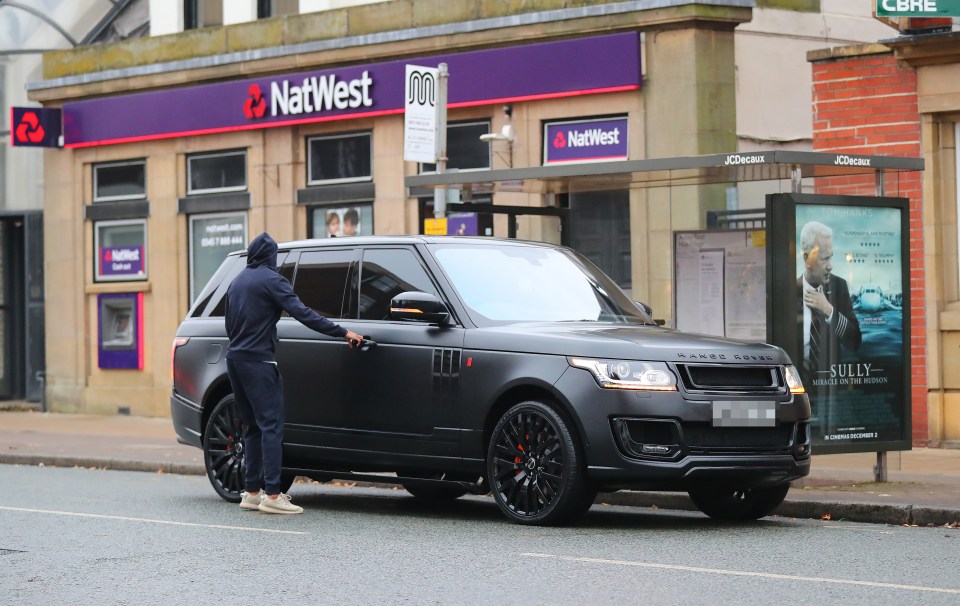 Ashley Young parked in a bus stop as he withdrew some cash