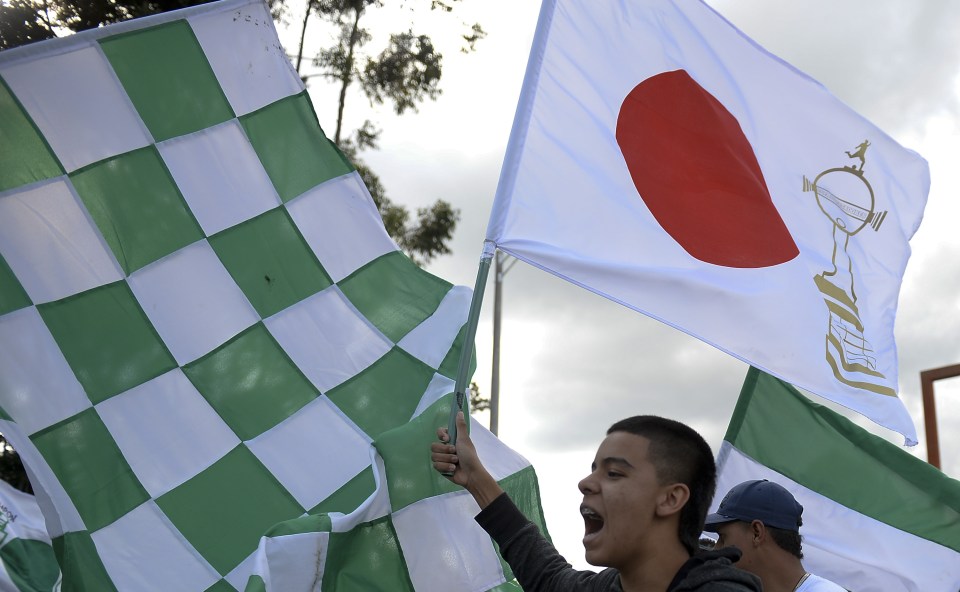 Supporters of Colombia's Atletico Nacional cheer for their team before they fly to the FIFA Club World Cup