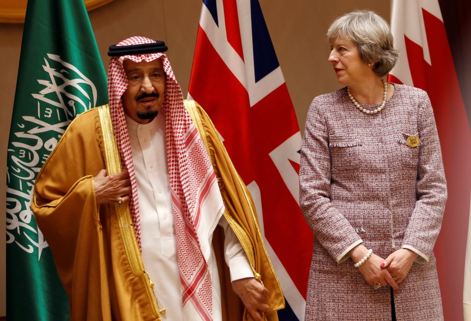  Theresa May speaks to Saudi King Salman bin Abulaziz Al-Saud during a group photo with the Gulf Cooporative Council's leaders earlier this week