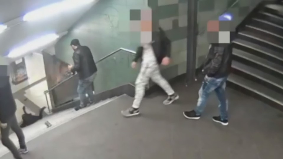  Police are hunting for the thug, who was with three friends, at the time of the attack