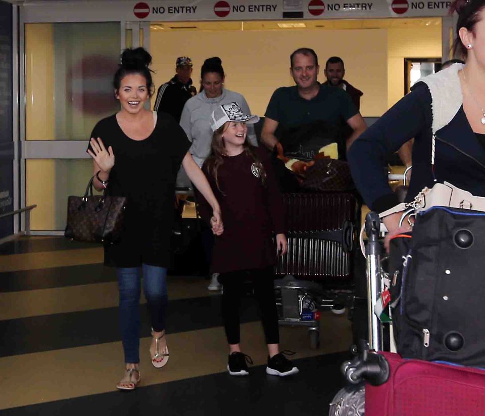 Scarlett arrived back with her family in tow