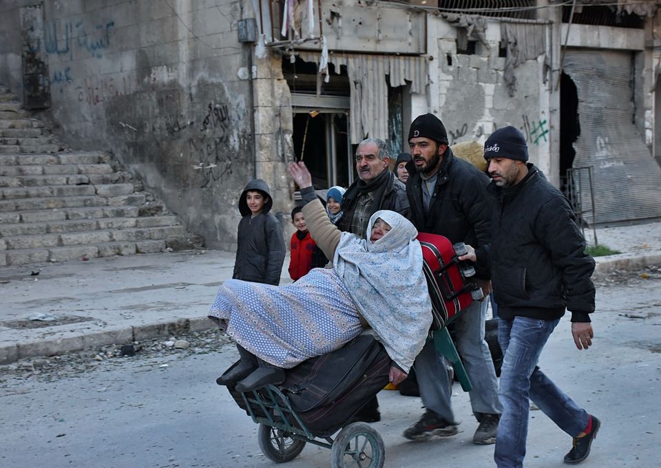  Syrian residents fleeing the violence in the eastern rebel-held parts of Aleppo