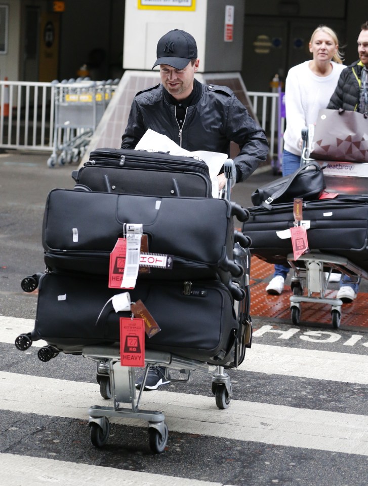 Dec pushed his own case loaded with big suitcases