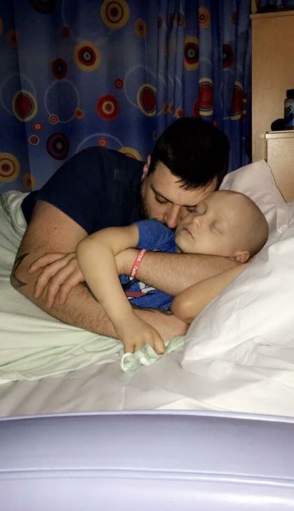  Bradley's dad Carl shared this heartbreaking image last December as he cuddles his son