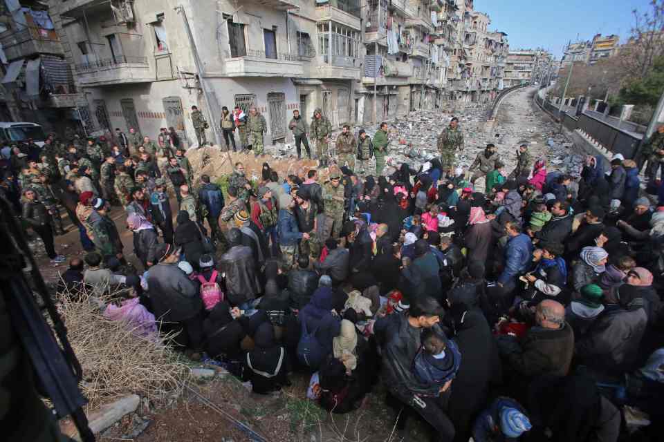  Syrian residents fleeing the violence in the Maysaloun neighbourhood, Aleppo