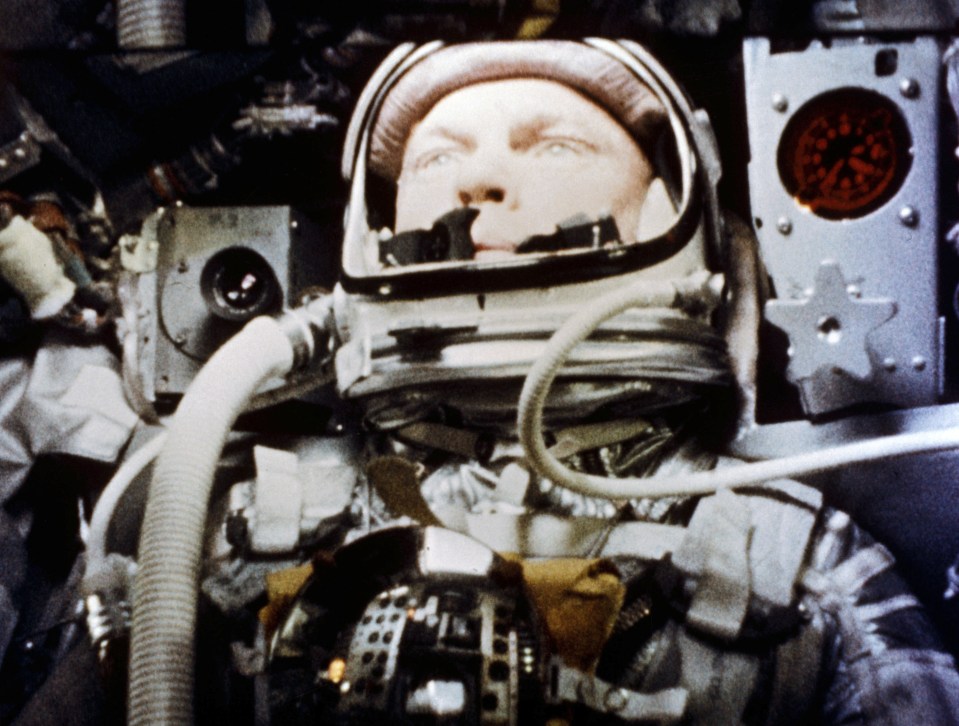  John Glenn pilots the "Friendship 7" Mercury spacecraft during his historic flight as the first American to orbit the Earth