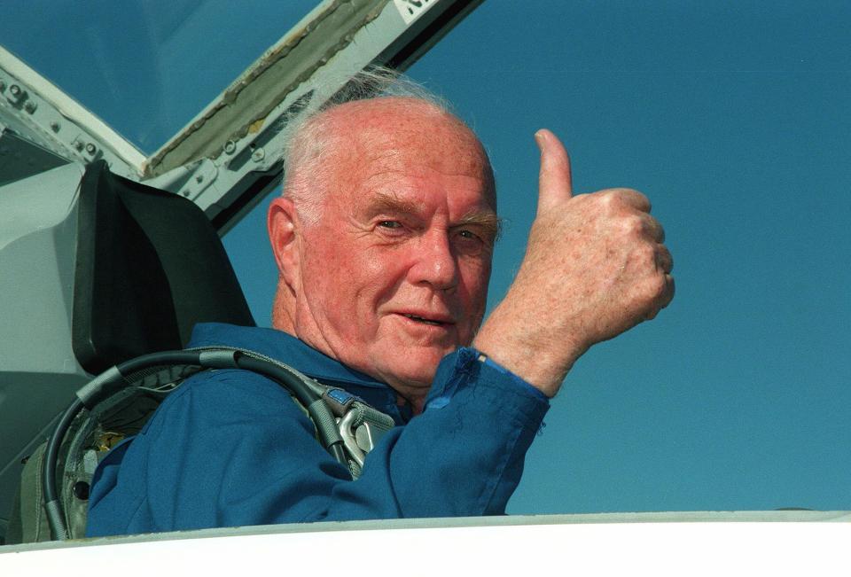  John gives a thumbs up as he arrives at the Kennedy Space Center in 1998