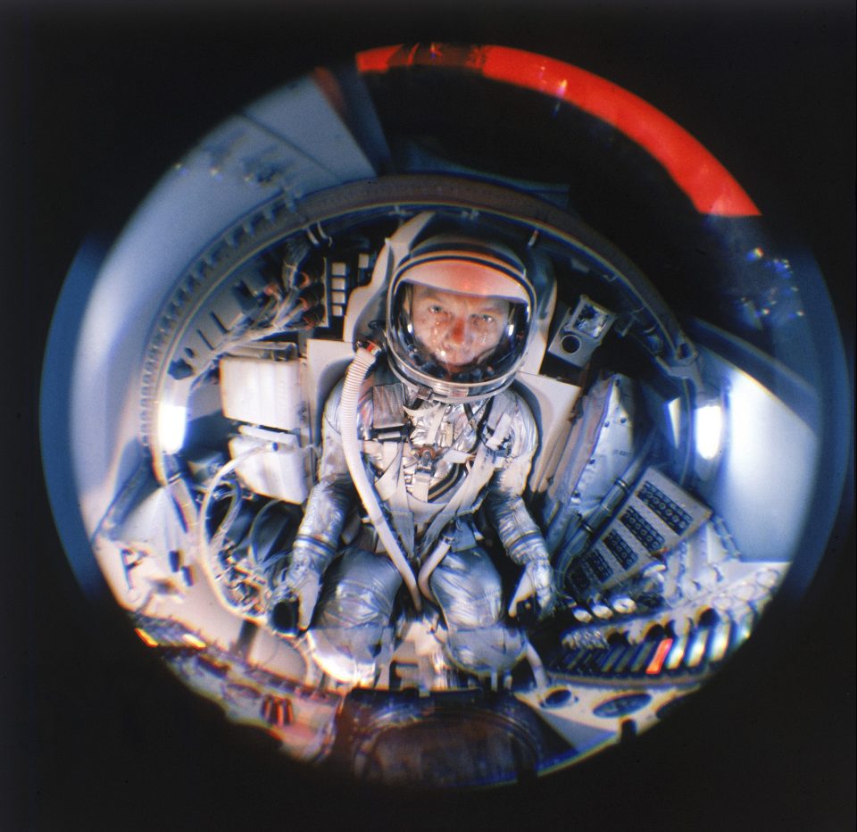  Fish eye view of Project Mercury astronaut John Glenn training in a mock up of the planned space capsule