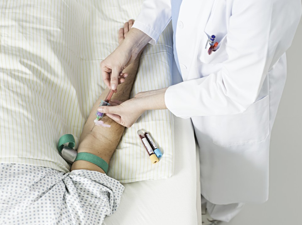 female doctor taking blood sample