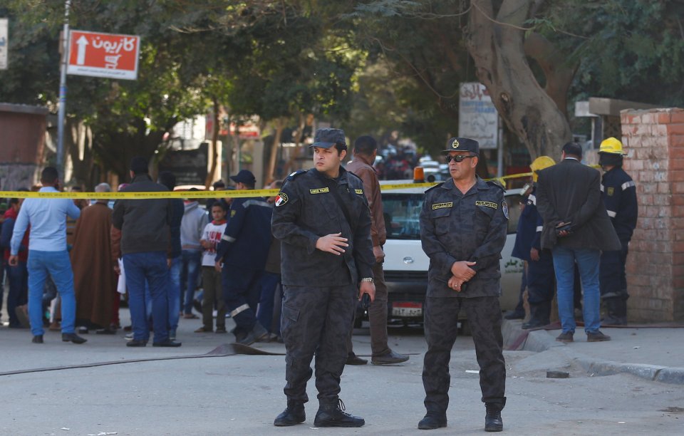 Special police officers stand guard at the scene of a bomb blast in Giza Al Haram Street on the outskirts of Cairo