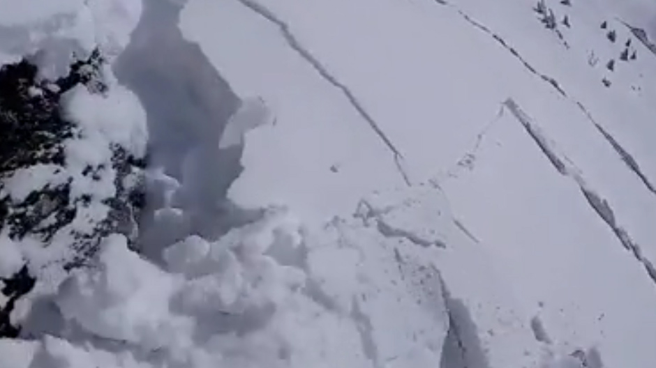  Footage shows the start of an avalanche with the snow breaking apart after the skier performed a defensive cutting move