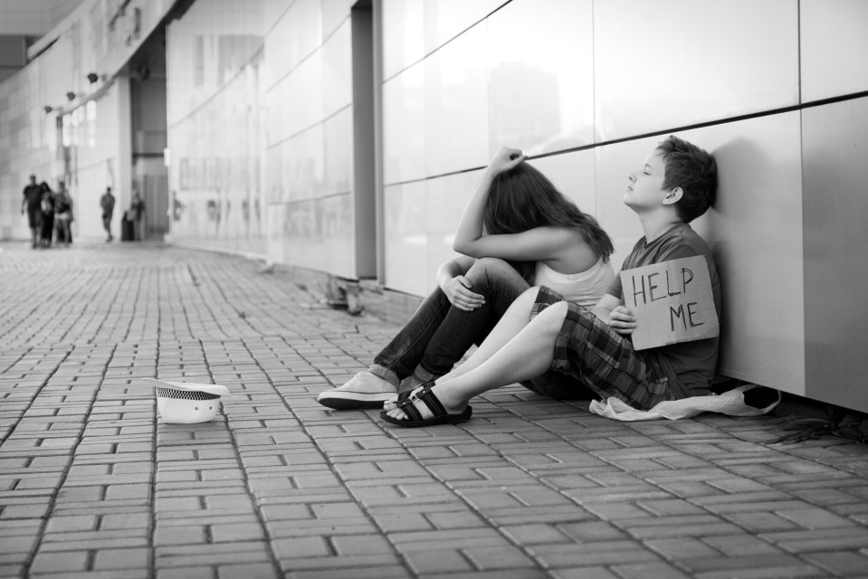 Homeless teenage boy and girl