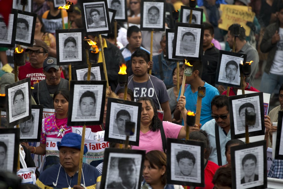  More than 30,000 people have gone missing since the war on drugs began, including 43 teachers college students, whose families are pictures holding their pictures