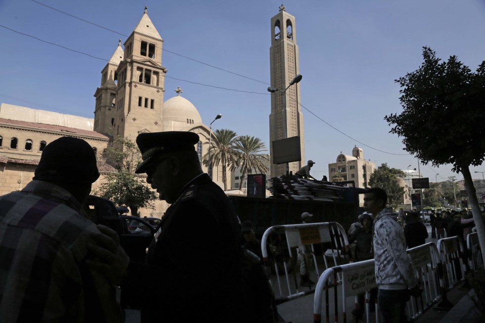 Members of the special police forces stand guard to secure the area around the blast site