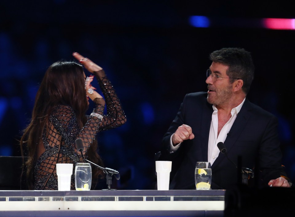  High five . . . Simon Cowell looks shocked by Nicole's reaction at the final