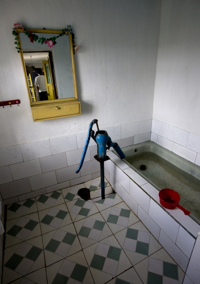 Eric said: "A visit to a rural home. Those houses and the families who live there are carefully selected by the government. But sometimes, a detail like a bathroom used as a cistern shows that times are hard"