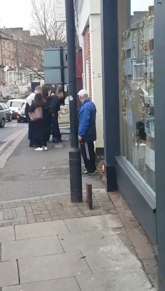  The suspect is cuffed in front of shocked shoppers