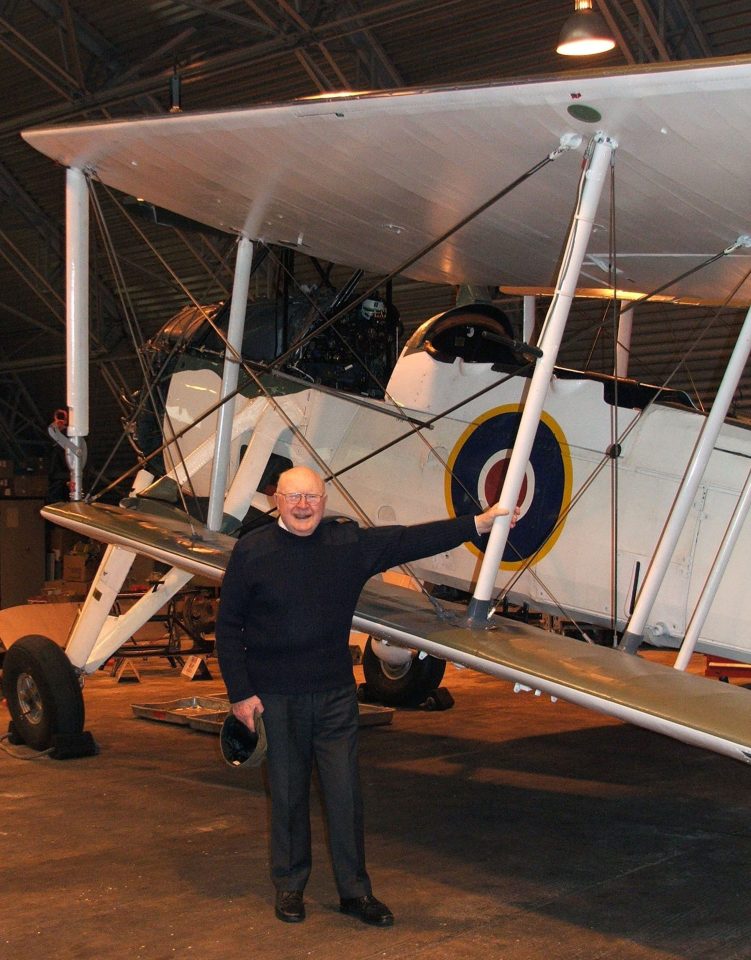  John Moffatt, who has died aged 97, poses alongside a Swordfish plane like the one he used to help sink the fearsome Bismarck battleship