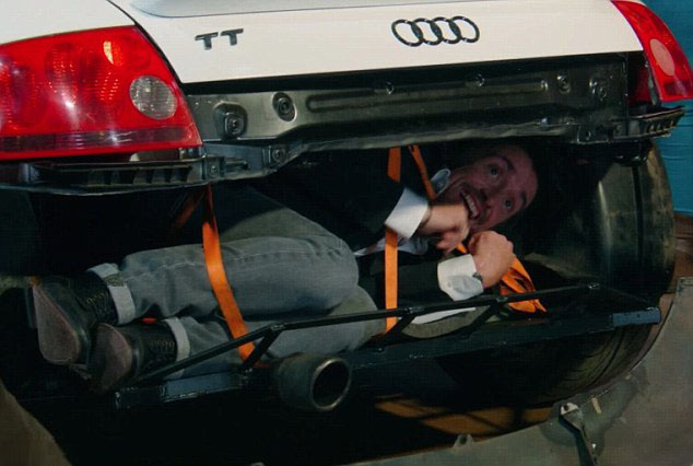  Hammond was in fits of giggles as he was crammed inside the frame of the car