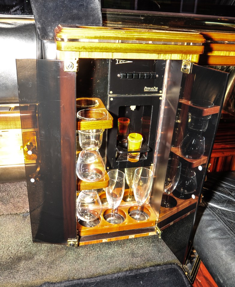  The car comes complete with glasses and a drinks cabinets - for sealing those business deals over a whisky