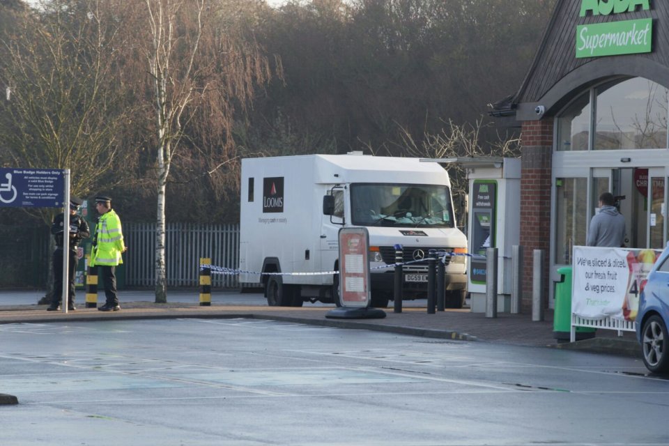  A security guard at the scene remains taped off as investigations continue