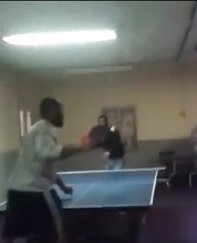  Two men look like they are in the middle of an intense game of table tennis during the challenge