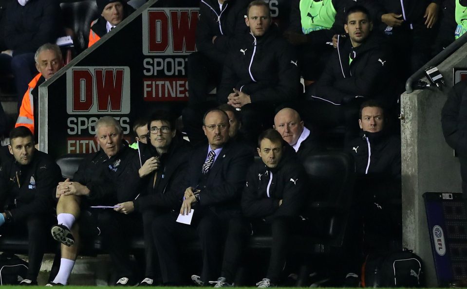 Rafa Benitez and his coaches watch his Toon team at the DW Stadium