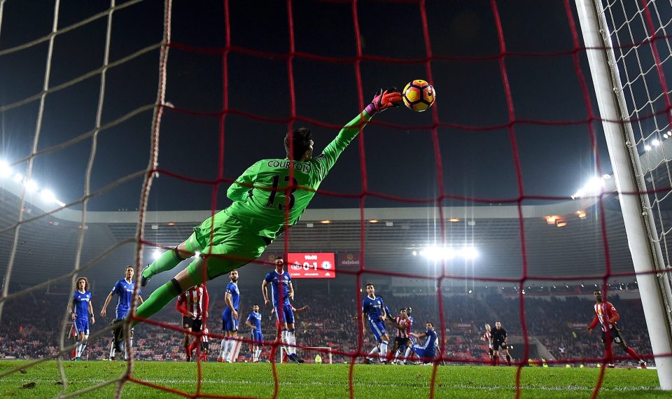 Thibaut Cortois dives full stretch to save from Patrick van Aanholt and seal victory for Chelsea at Sunderland