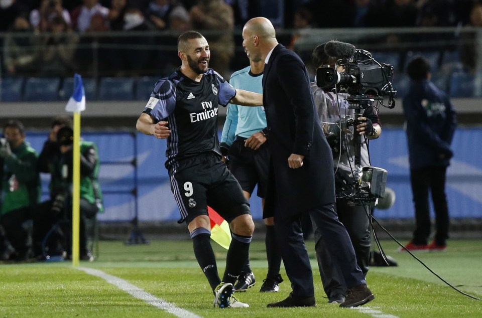 Real Madrid's Karim Benzema celebrates with boss Zinedine Zidane