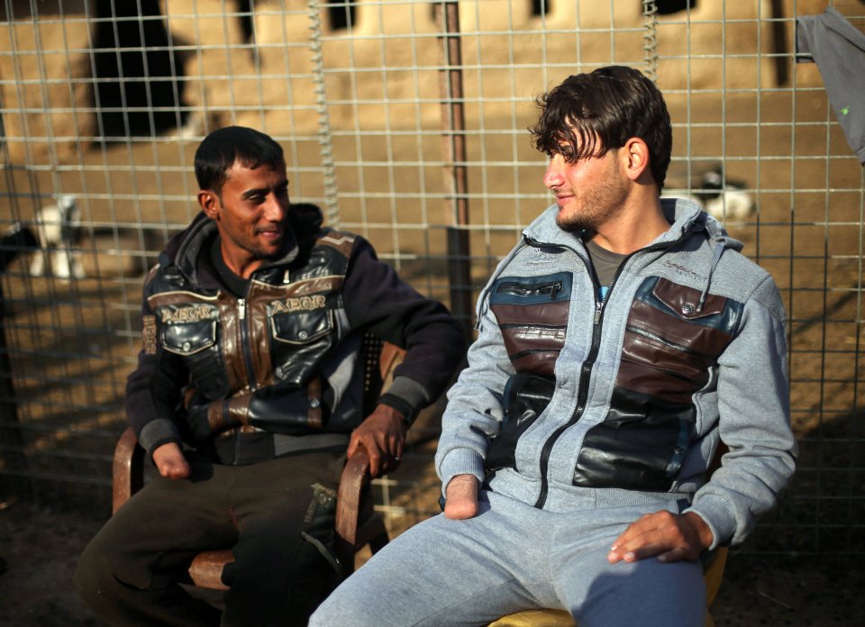  Azad Hassan, right, and his brother Mohammad, left, both had their right hands cut off for 'stealing'