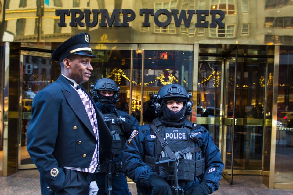  Heavily armed New York City Police (NYPD) officers stand guard at the entrance of Trump Tower (file photo)